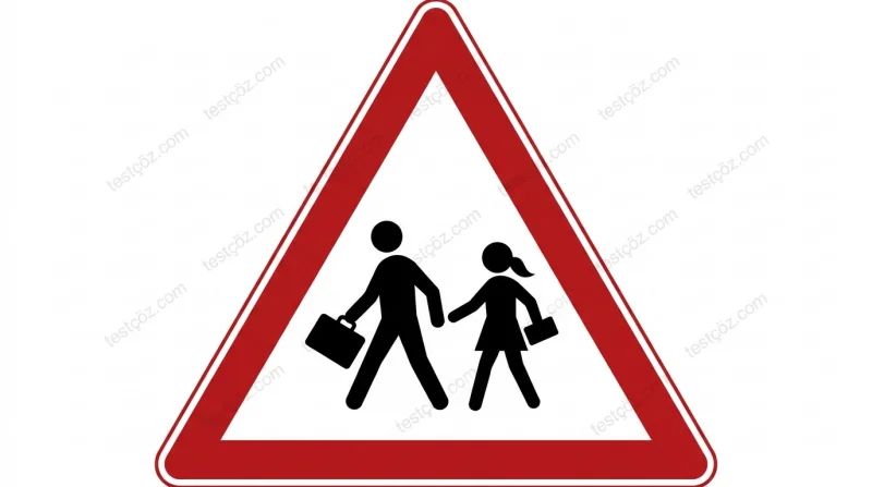 Okul çıkabilir / yaya yaklaşımı trafik işareti — kırmızı çerçeveli üçgen içinde çocuklar